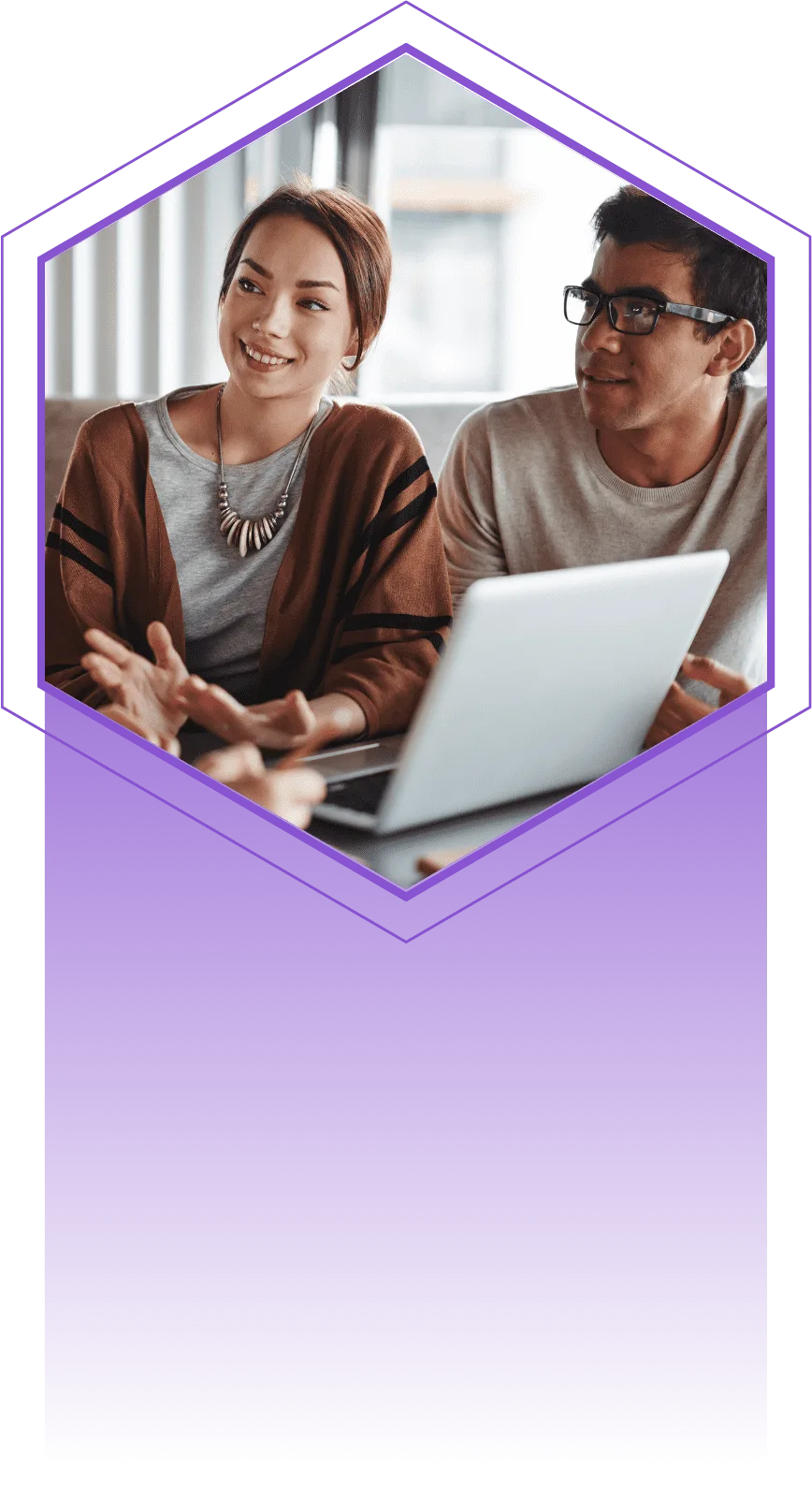 Two colleagues reviewing a laptop together