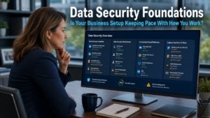 Business owner reviewing a data security audit checklist on a monitor showing cloud systems, user access permissions, and legacy platform connections in a modern office, representing the need to review data security foundations as businesses grow