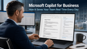 Business professional using Microsoft Copilot in Word on a laptop in a modern office with an AI draft visible on screen, representing how Microsoft Copilot for business saves time on everyday tasks