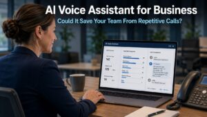 Business professional reviewing an AI voice assistant interface on a laptop in a modern office while a phone sits beside the keyboard, representing how an AI voice assistant for business can handle repetitive customer calls and free up team time